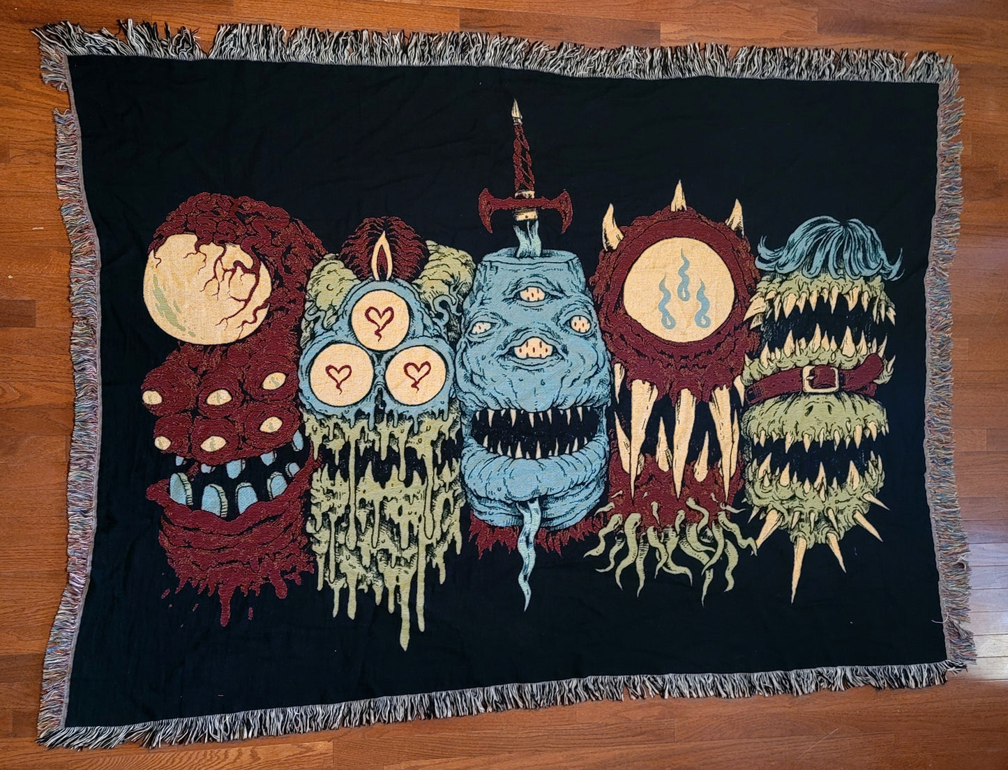 Sword Stabbed 5 Heads in a Row Woven Blanket